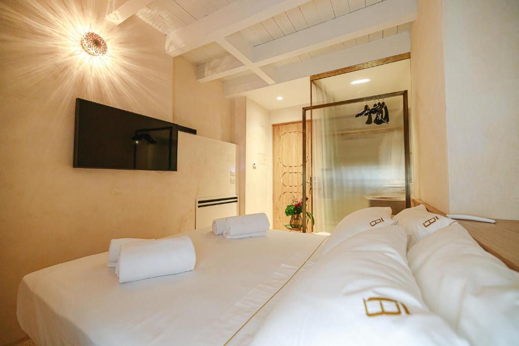 A bed or beds in a room at BAYIT Charming Place