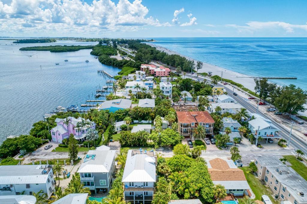 an aerial view of a resort next to the ocean at AMI Lighthouse Cottage-One Minute Walk To The Beach-Keyless Locks in Bradenton Beach