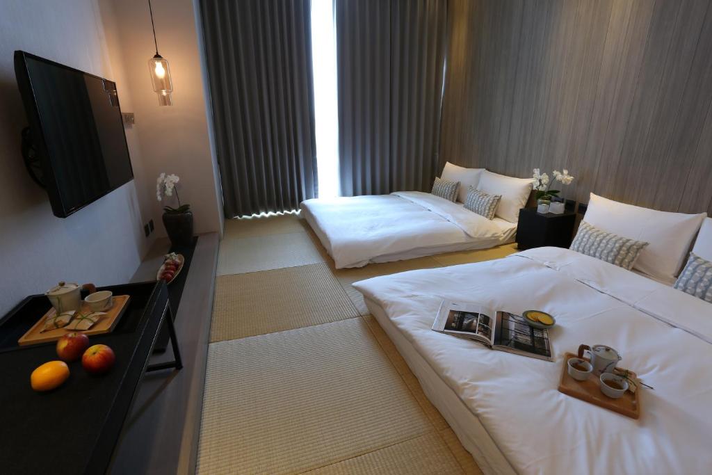 Voodi või voodid majutusasutuse Hotel Day Plus Teascape toas