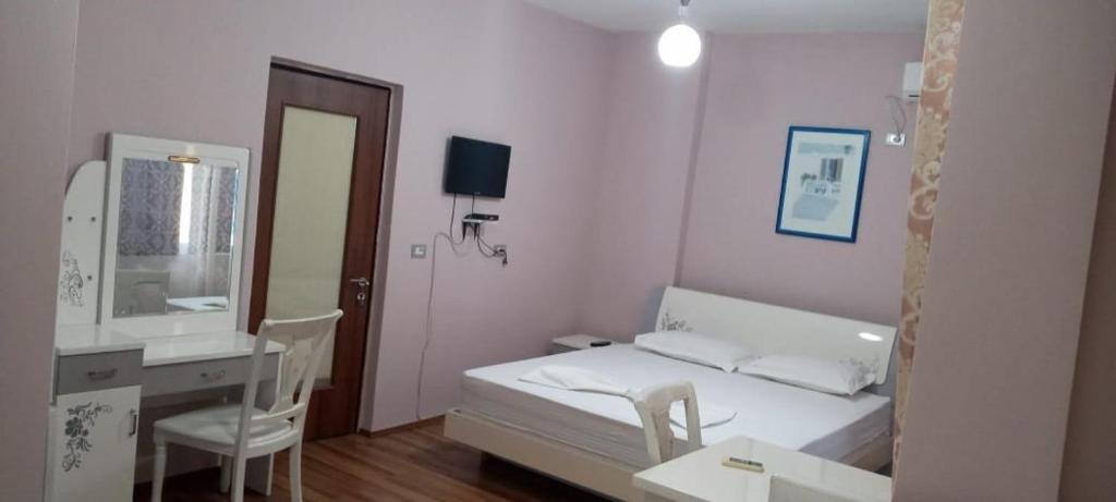 Postel nebo postele na pokoji v ubytování British Hotel