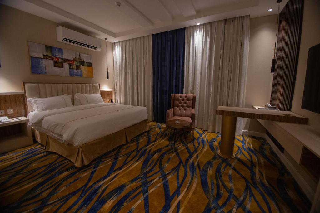 Postel nebo postele na pokoji v ubytování فندق قوبا السويس - Quba Swess Hotel Jazan