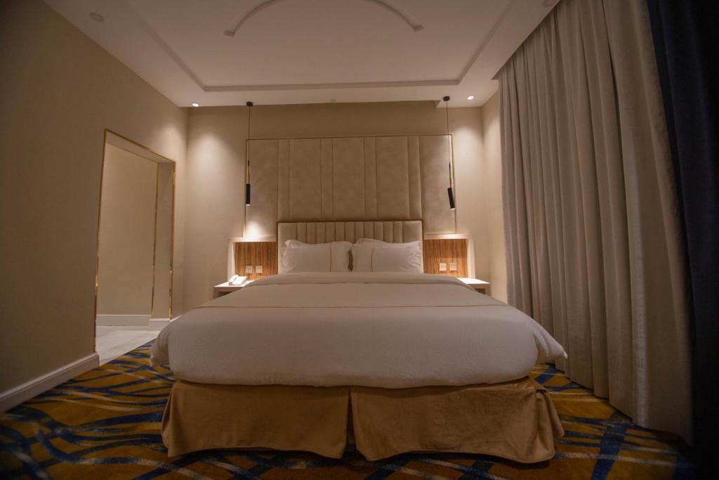 Postel nebo postele na pokoji v ubytování فندق قوبا السويس - Quba Swess Hotel Jazan