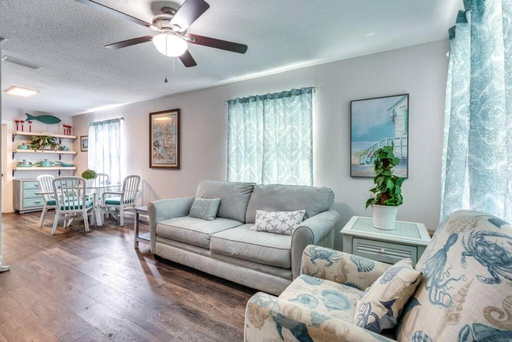 a living room with a couch and a table at Cortez Gardens Cottage 15, Renovated and close to Beach, 3-Bed, 2-Bath 10 People in Bradenton