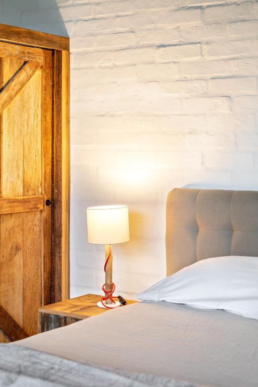 Cama o camas de una habitación en Mataka'a - Chalé Industrial na Mantiqueira