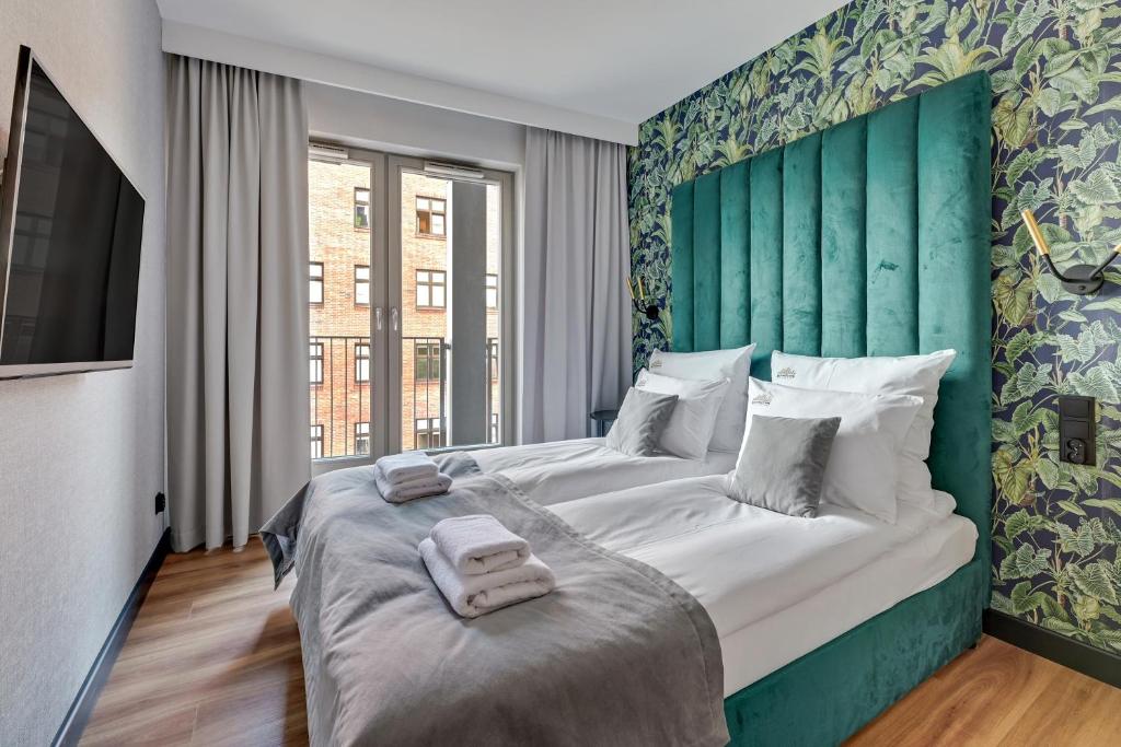Posteľ alebo postele v izbe v ubytovaní Grano Residence - Pool, Sauna, SPA & Parking by Downtown Apartments