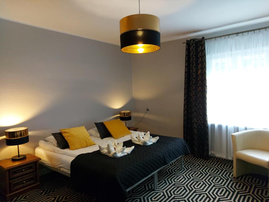 Een bed of bedden in een kamer bij Apartament Konopnicka
