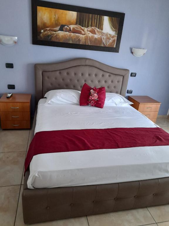 Postel nebo postele na pokoji v ubytování Hotel De Rosa