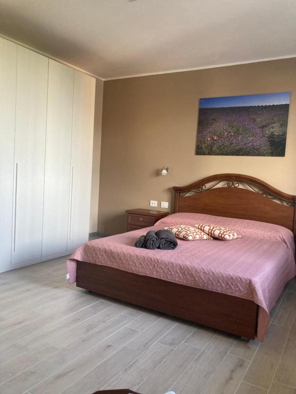 A bed or beds in a room at IL CORTILE DI GRETA