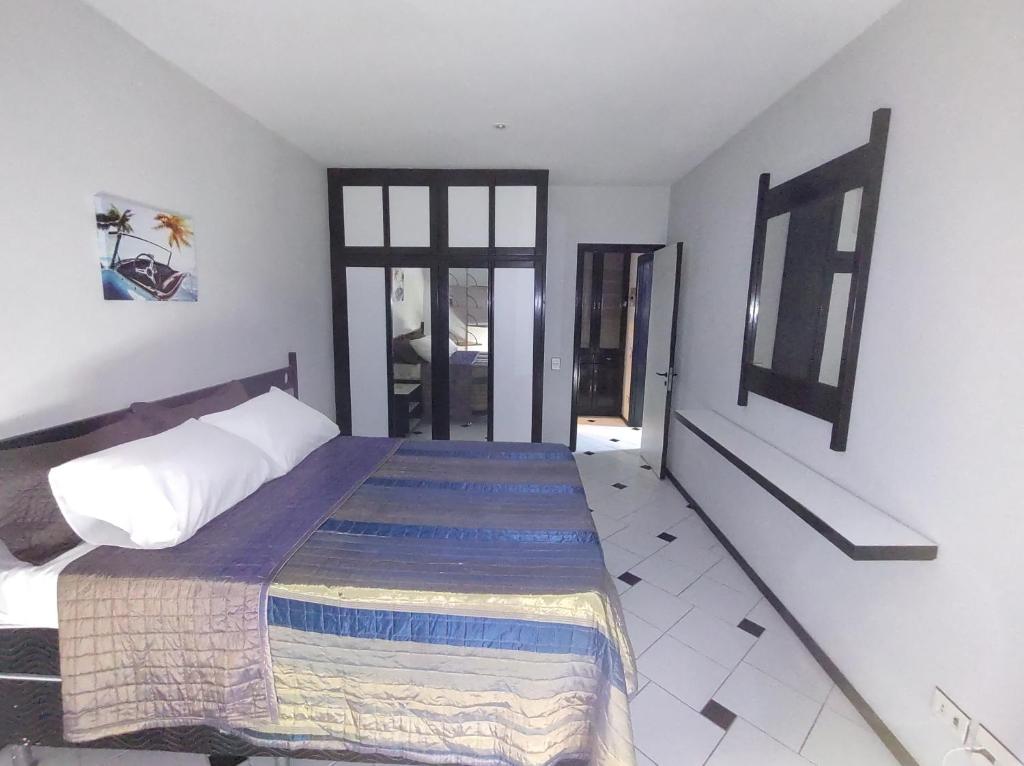 Gulta vai gultas numurā naktsmītnē Copacabana - Hotel Flat Real Residence - 500 metros da Praia