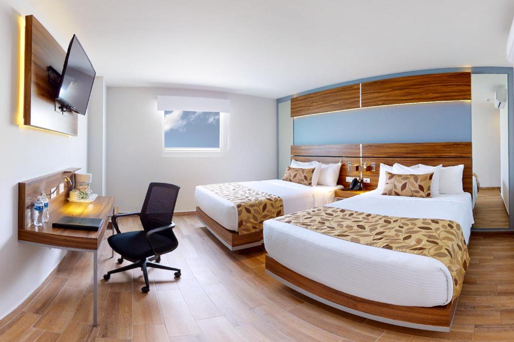 Postel nebo postele na pokoji v ubytování Sleep Inn Queretaro