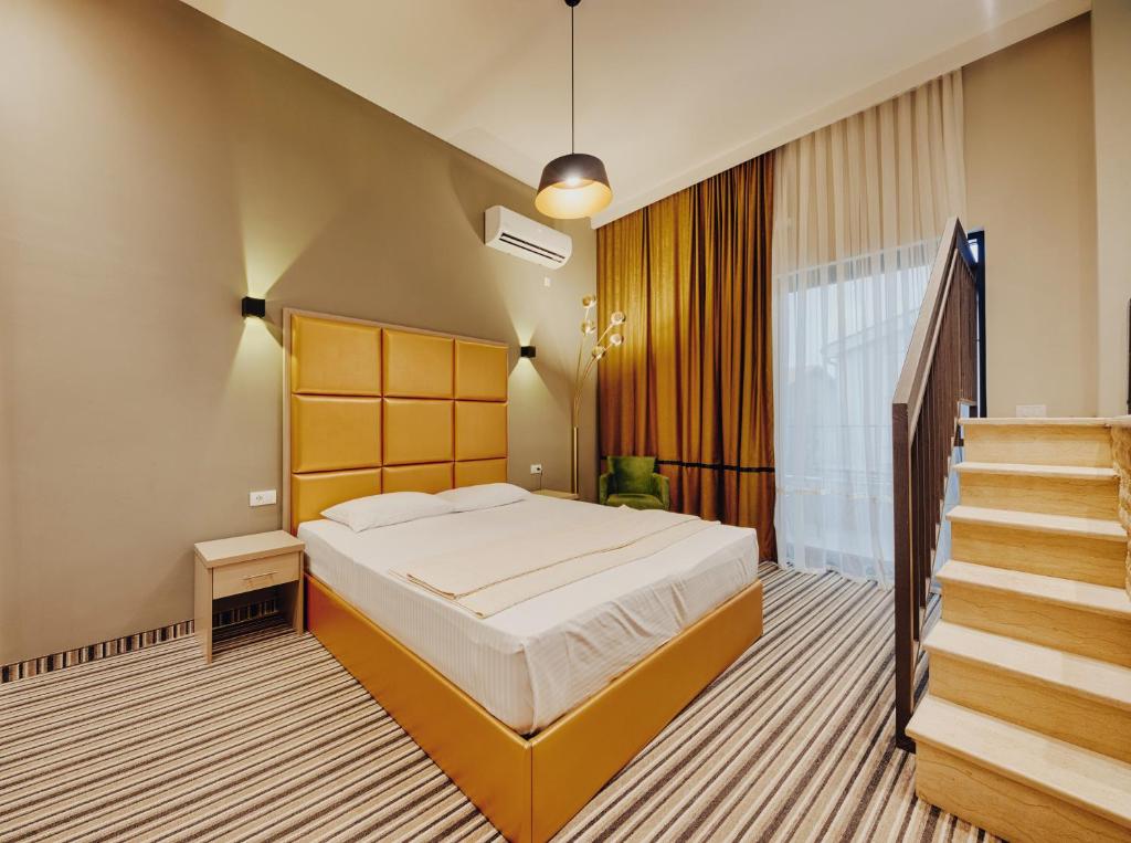 Postel nebo postele na pokoji v ubytování AM Palace