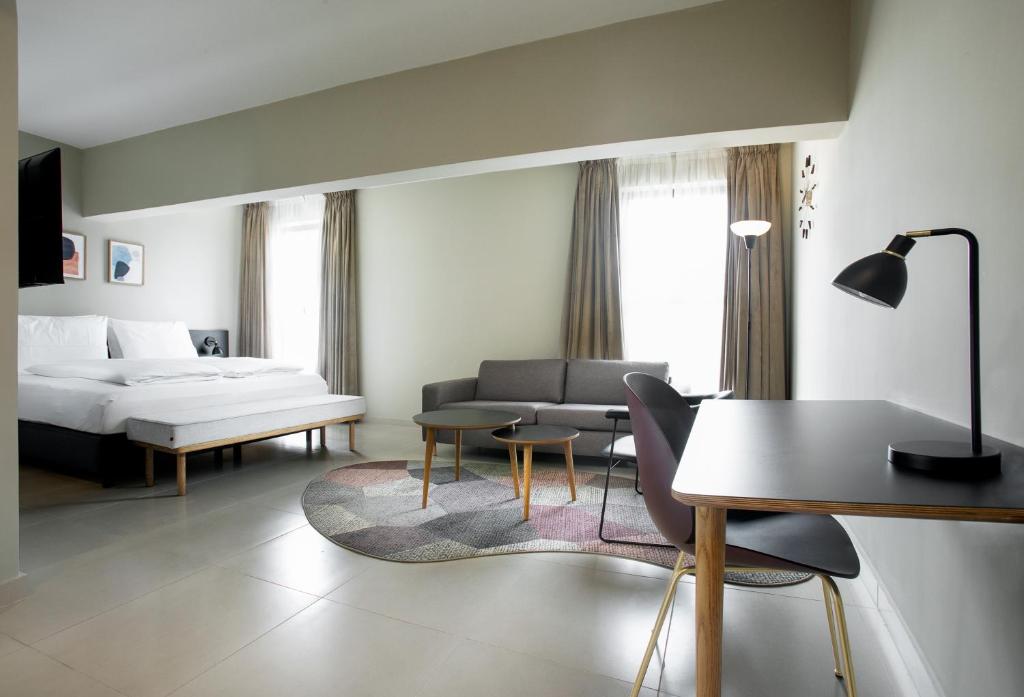 Rúm í herbergi á Nordic Hotel Lagos