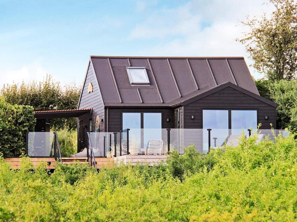 a house with a metal roof at 4 person holiday home in S nder Stenderup in Sønder Stenderup