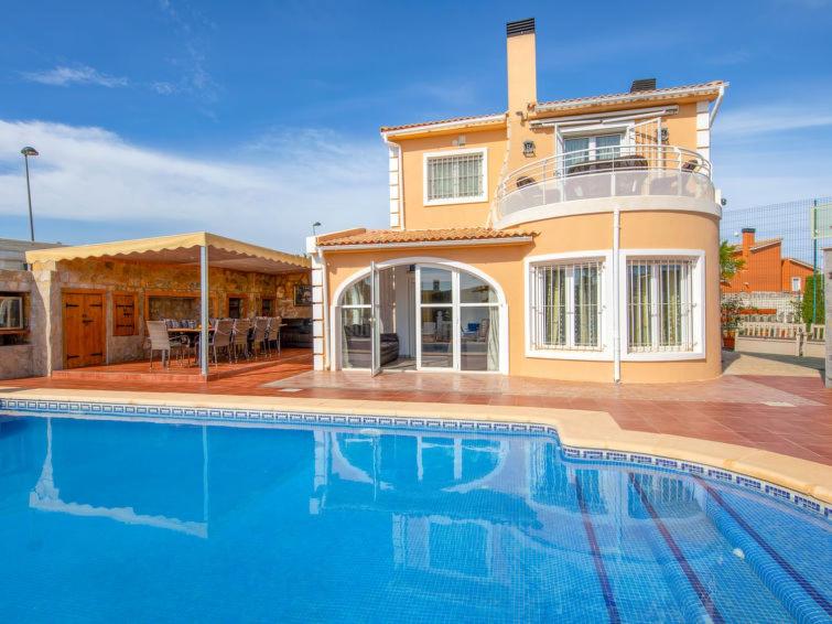 a large swimming pool in front of a house at El Descanso in Gata de Gorgos