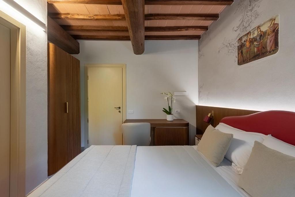 Postel nebo postele na pokoji v ubytování Borgo Di Celle