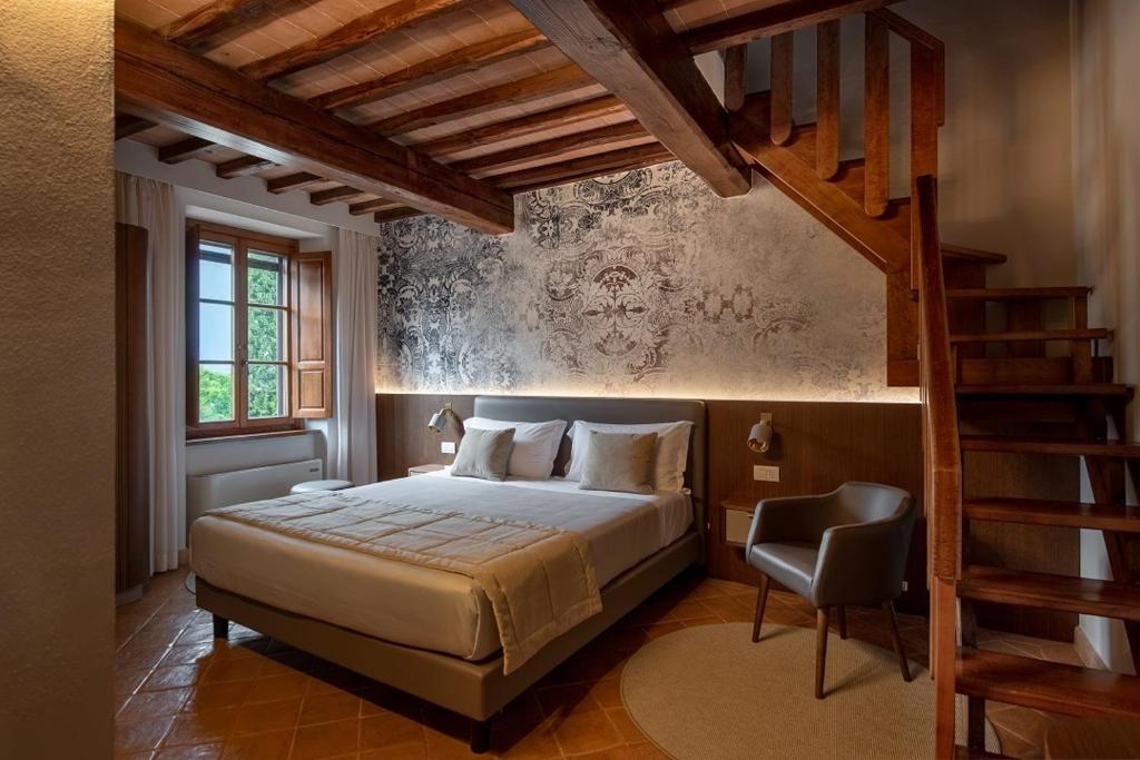 Postel nebo postele na pokoji v ubytování Borgo Di Celle