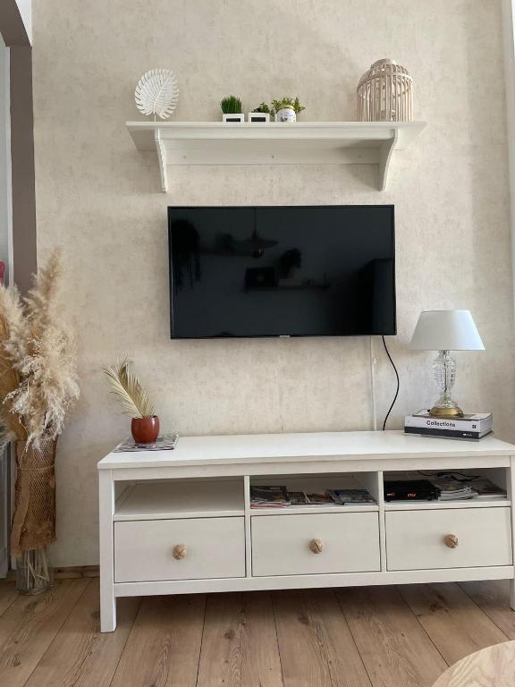 Uma televisão e/ou sistema de entretenimento em Apartment Ria