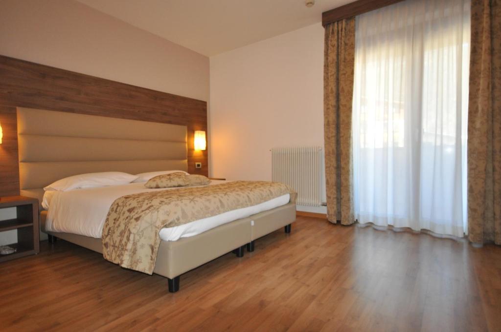 Postel nebo postele na pokoji v ubytování Hotel Select
