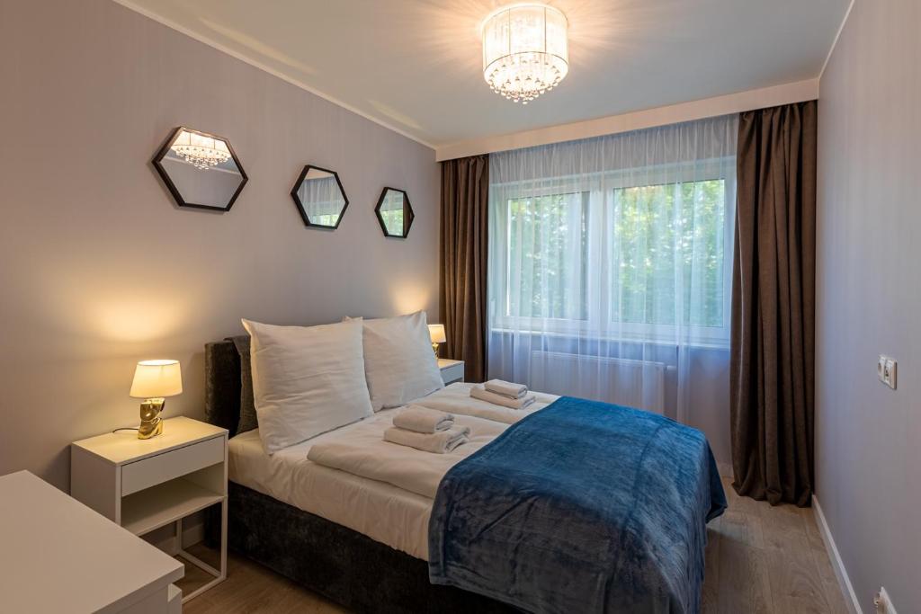 Posteľ alebo postele v izbe v ubytovaní Przytulne Apartamenty Sun Seasons 24 z Pięknym Widokiem w Szklarskiej Porębie by Noclegi Renters