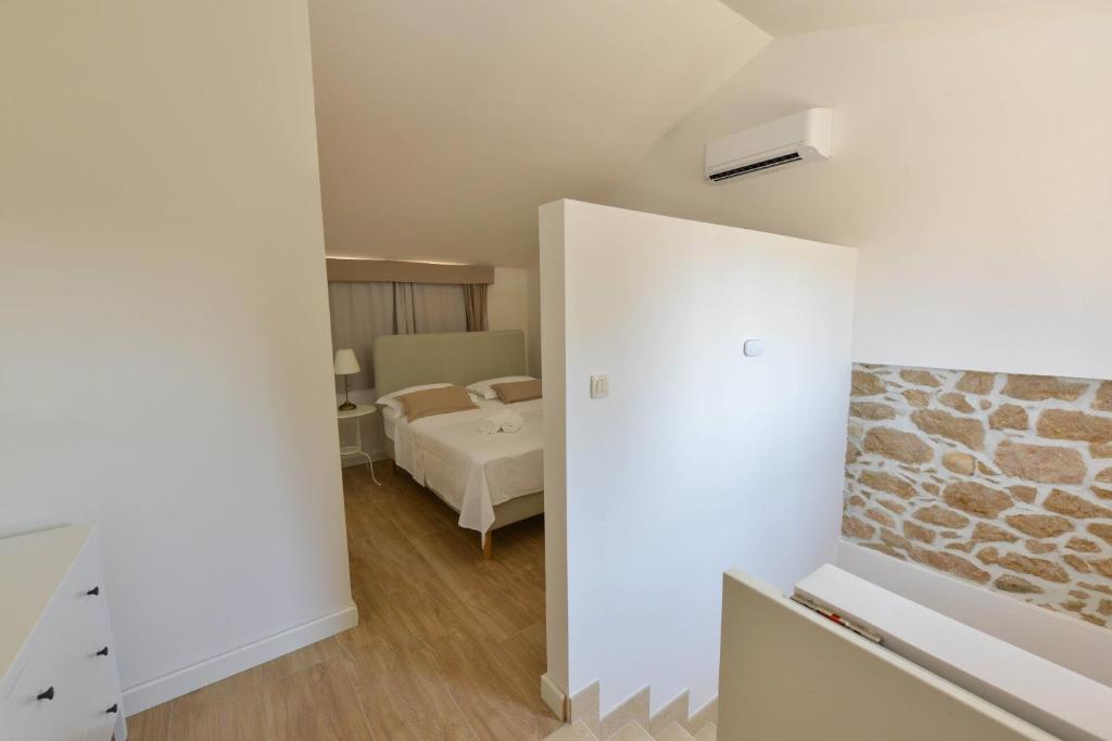 Postel nebo postele na pokoji v ubytování TERRACED HOUSES Ruzmarin 2025