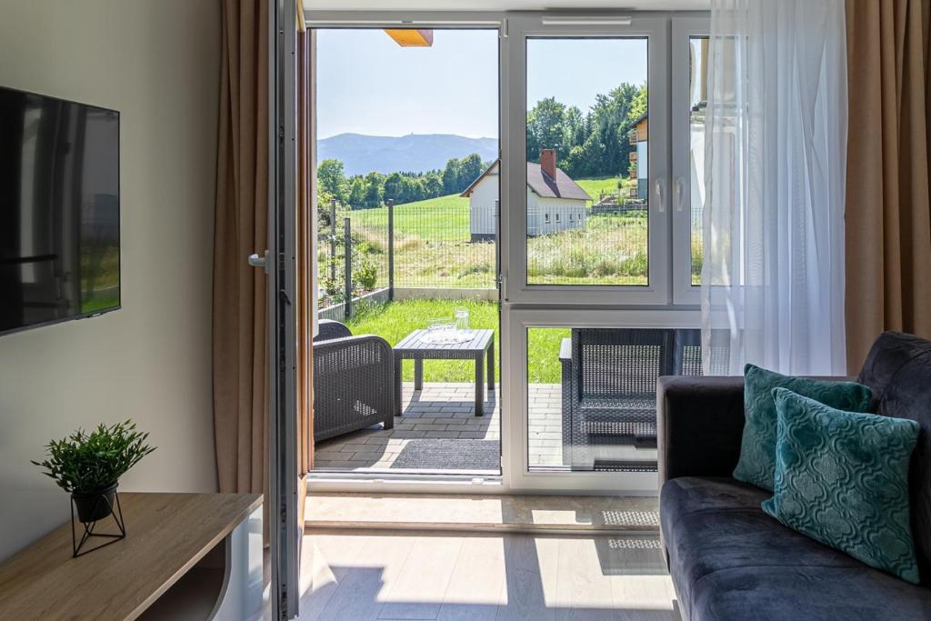 Posedenie v ubytovaní Przytulne Apartamenty Sun Seasons 24 z Pięknym Widokiem w Szklarskiej Porębie by Noclegi Renters
