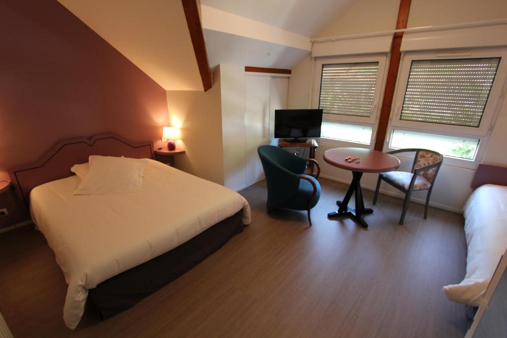 Postel nebo postele na pokoji v ubytování Beau Rivage