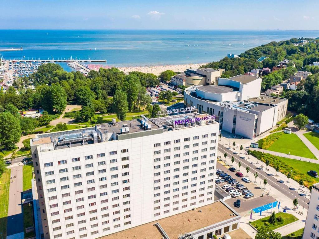 a large building with a view of the ocean at Mercure Gdynia Centrum in Gdynia