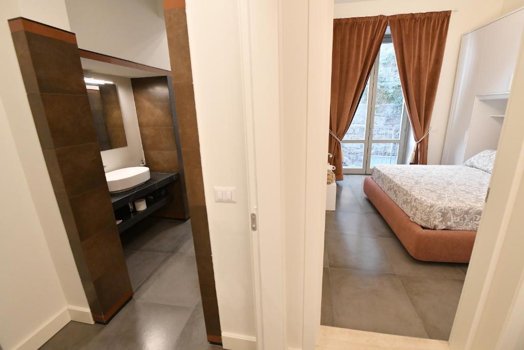 Postel nebo postele na pokoji v ubytování Palazzo degli Stemmi