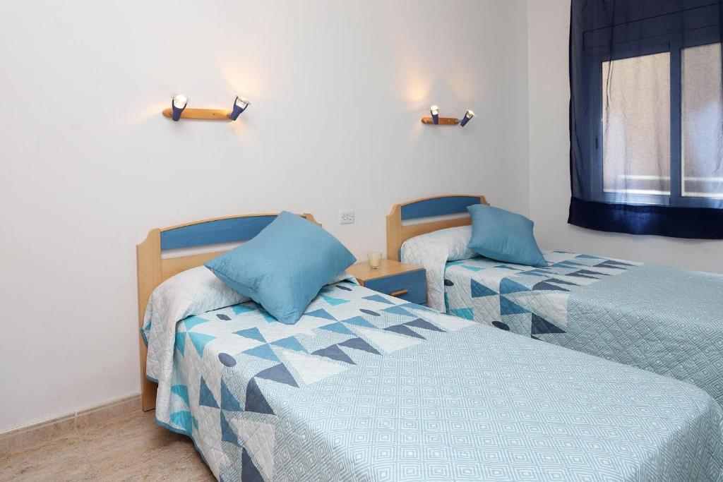 Postel nebo postele na pokoji v ubytování AT174 Apartamento en segunda línea de la playa, wifi