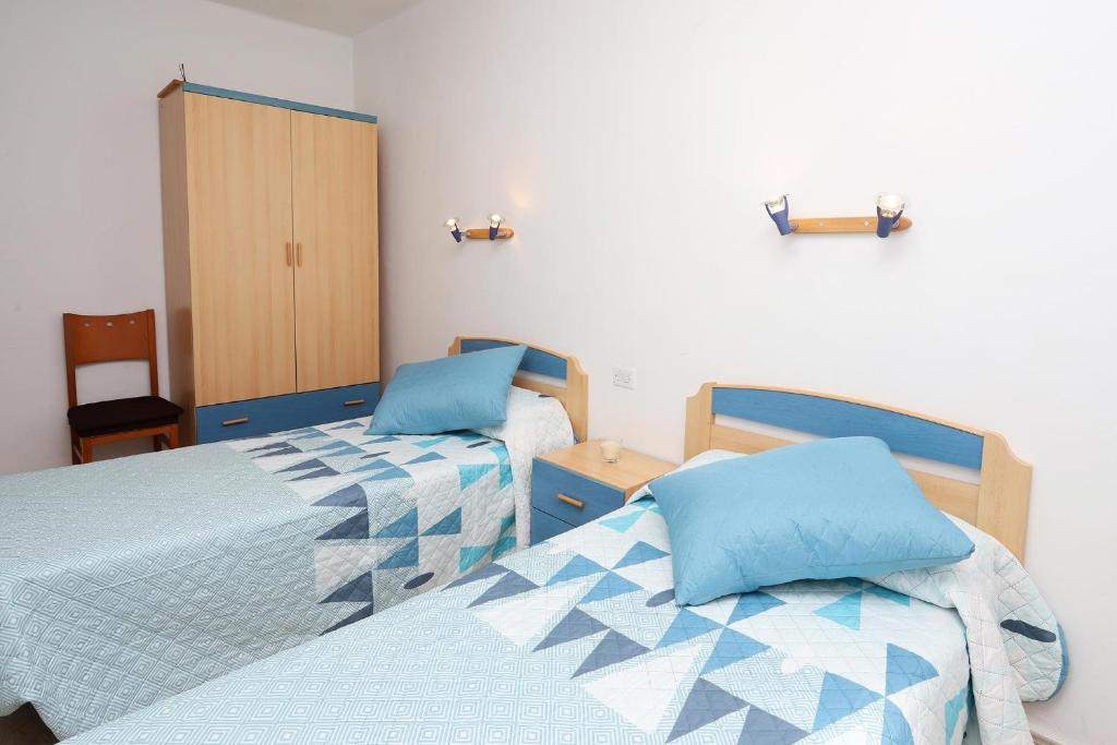 Postel nebo postele na pokoji v ubytování AT174 Apartamento en segunda línea de la playa, wifi
