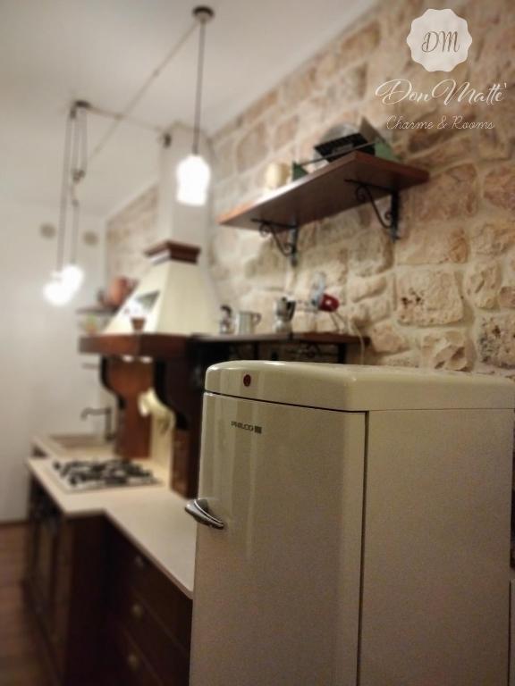 Kuchyň nebo kuchyňský kout v ubytování DonMattè - Charme & Rooms
