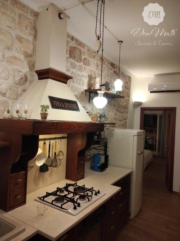 Kuchyň nebo kuchyňský kout v ubytování DonMattè - Charme & Rooms