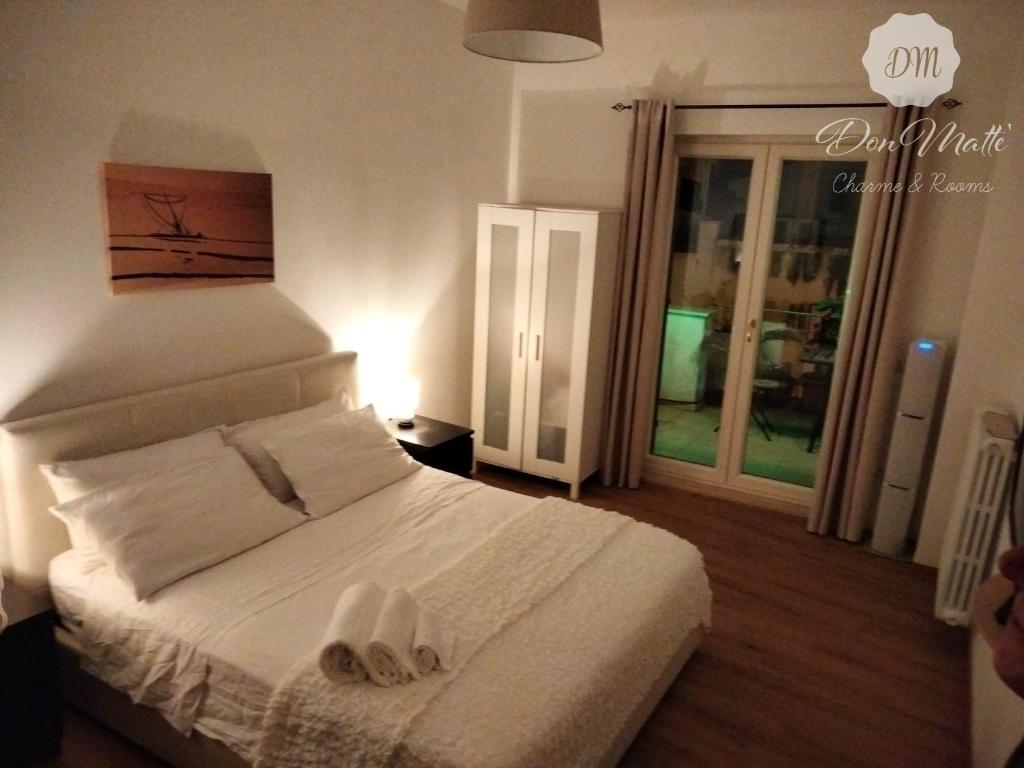 Postel nebo postele na pokoji v ubytování DonMattè - Charme & Rooms