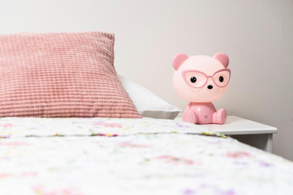 Postel nebo postele na pokoji v ubytování APARTMÁNY VILA LIBĚNA