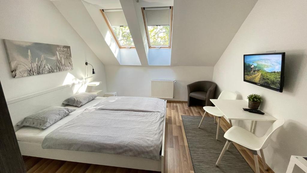 Posteľ alebo postele v izbe v ubytovaní Benevia Apartments