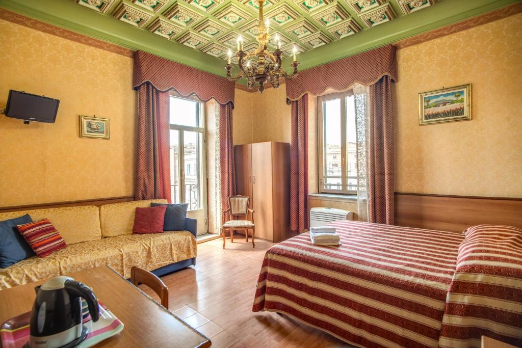 Postel nebo postele na pokoji v ubytování Hotel Artromano