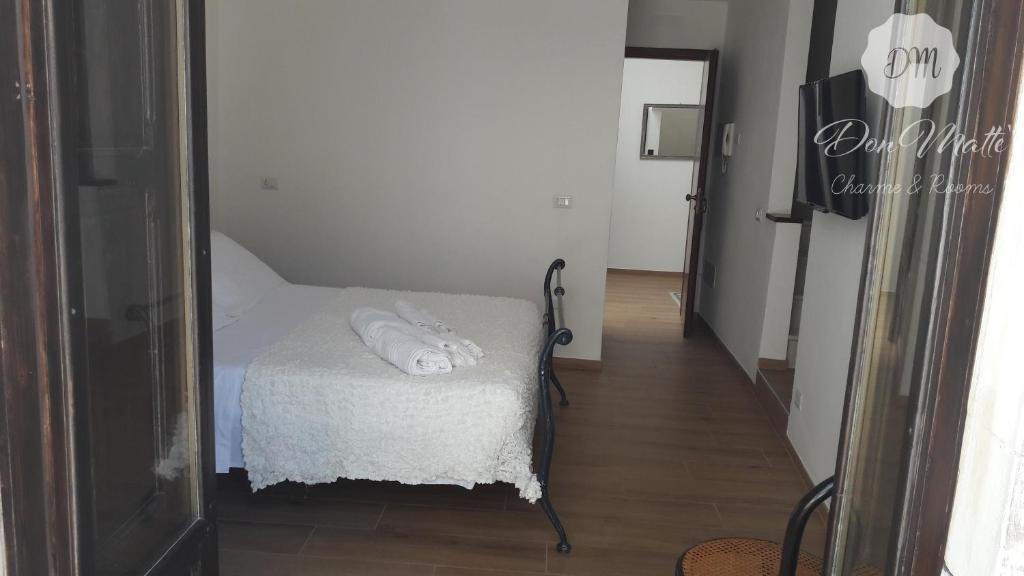 Postel nebo postele na pokoji v ubytování DonMattè - Charme & Rooms