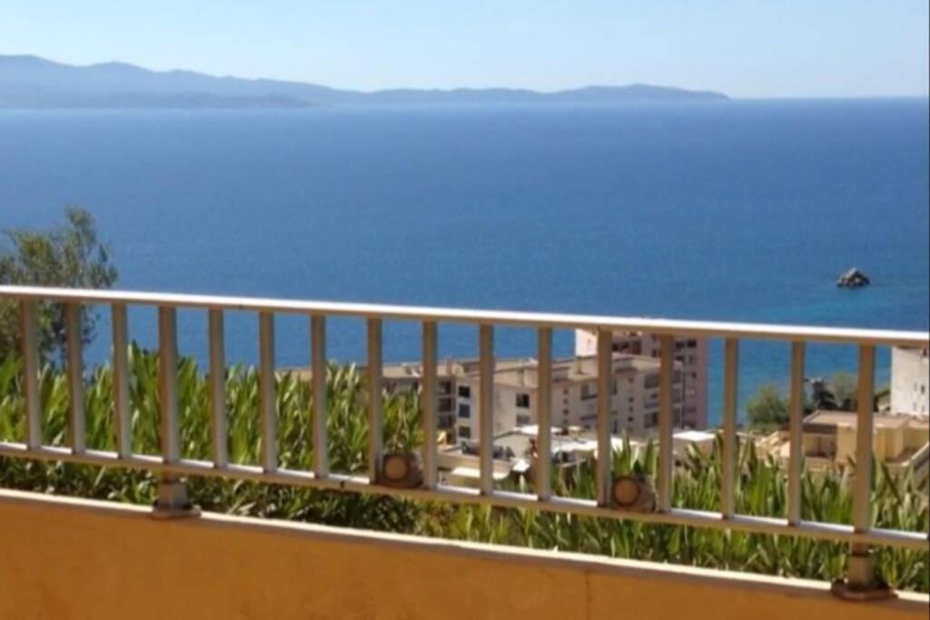 a balcony with a view of the ocean at T2 Sanguinaires calme et cosy, entre mer et maquis in Ajaccio