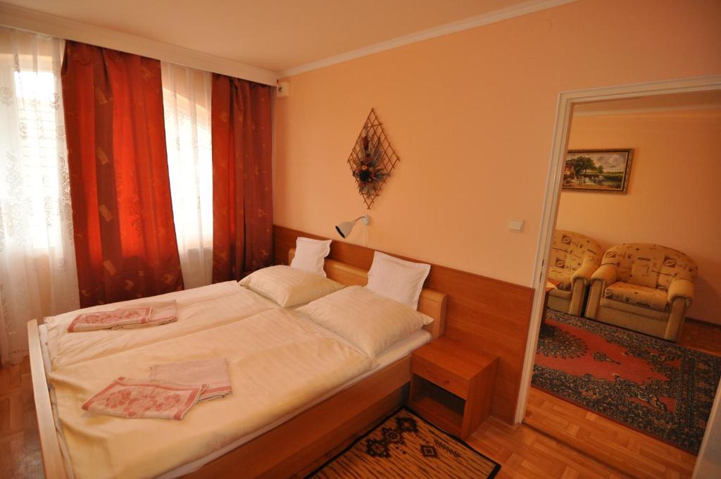 Postel nebo postele na pokoji v ubytování Hotel Átrium