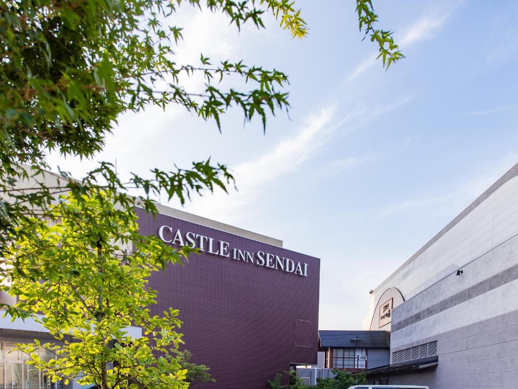 a building with a sign that reads castle law school at Castle Inn Sendai in Sendai