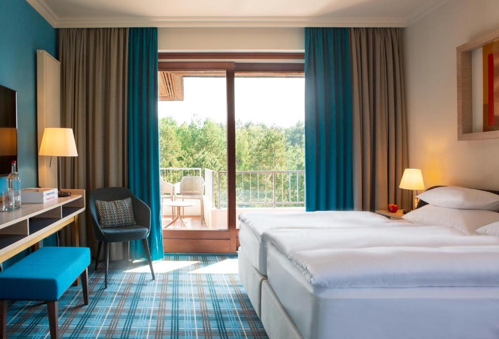Postel nebo postele na pokoji v ubytování Aalernhüs hotel & spa