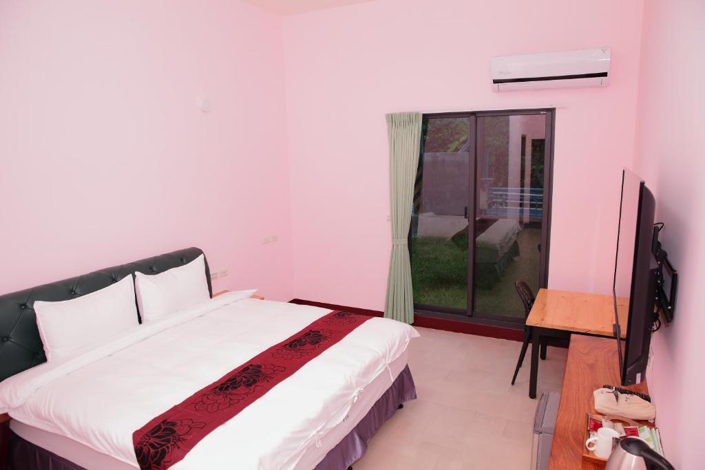 Postel nebo postele na pokoji v ubytování Yuan Homestay