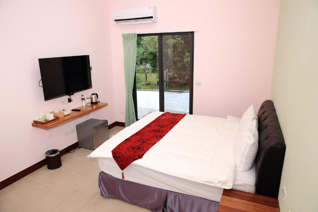 Postel nebo postele na pokoji v ubytování Yuan Homestay
