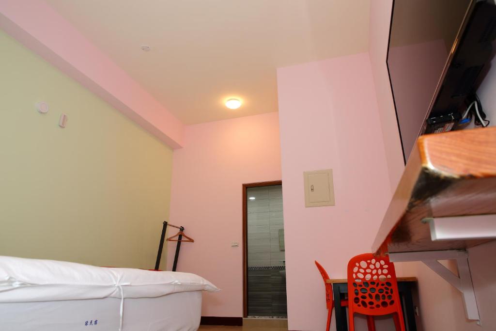 Postel nebo postele na pokoji v ubytování Yuan Homestay