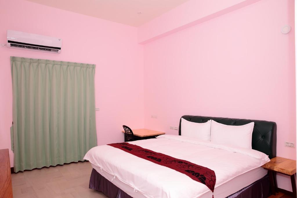 Postel nebo postele na pokoji v ubytování Yuan Homestay