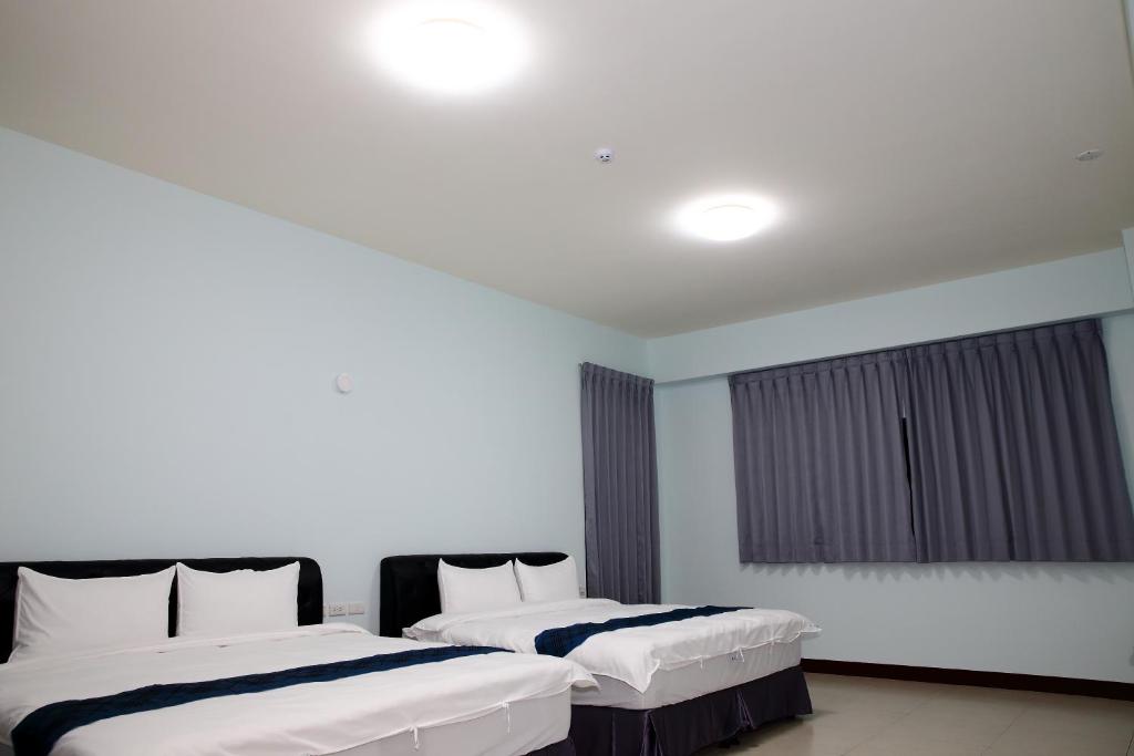 Postel nebo postele na pokoji v ubytování Yuan Homestay
