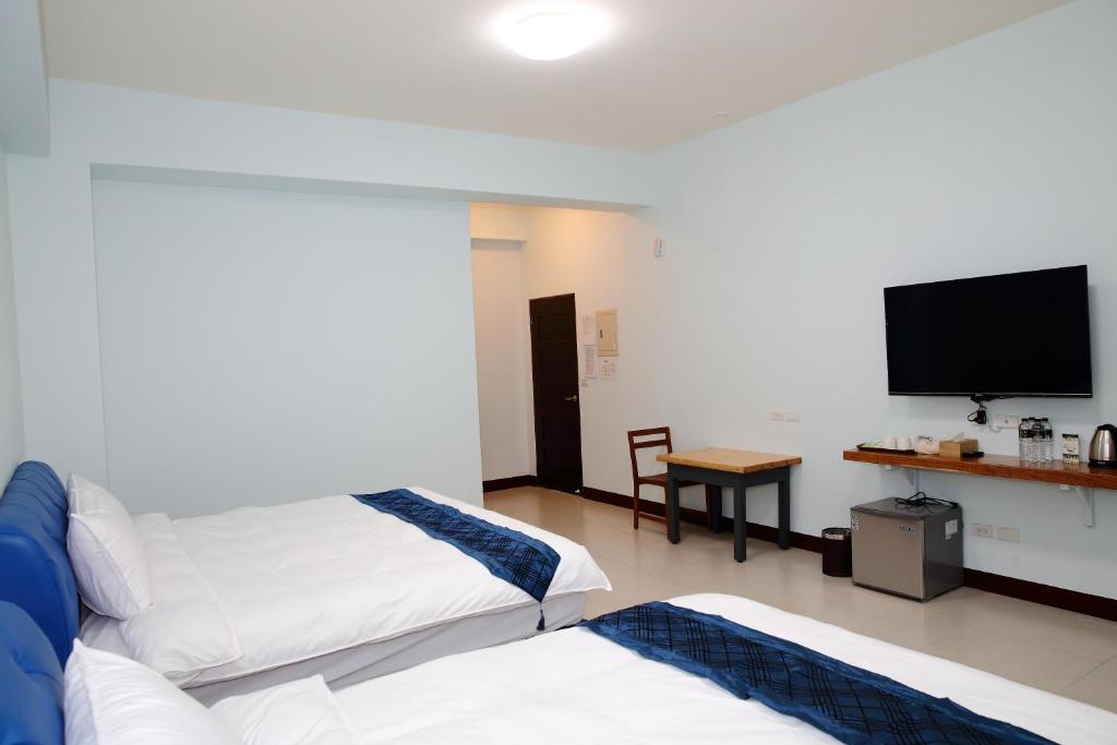 Postel nebo postele na pokoji v ubytování Yuan Homestay