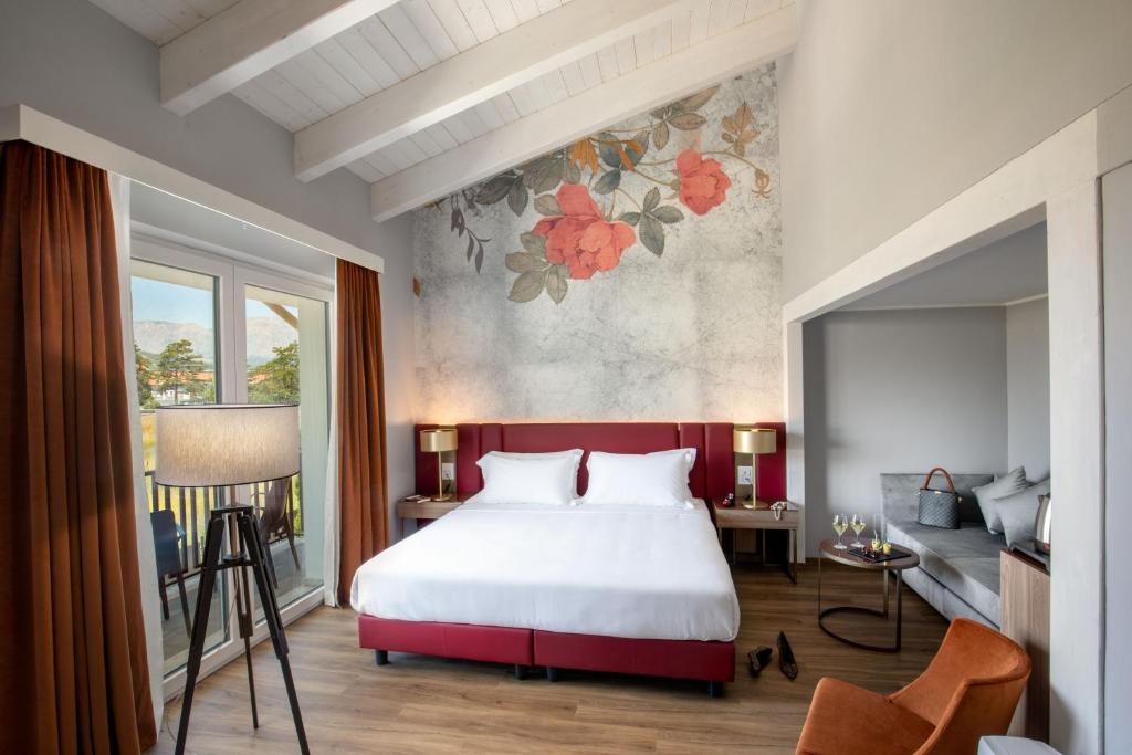 Postel nebo postele na pokoji v ubytování Hotel Della Piana