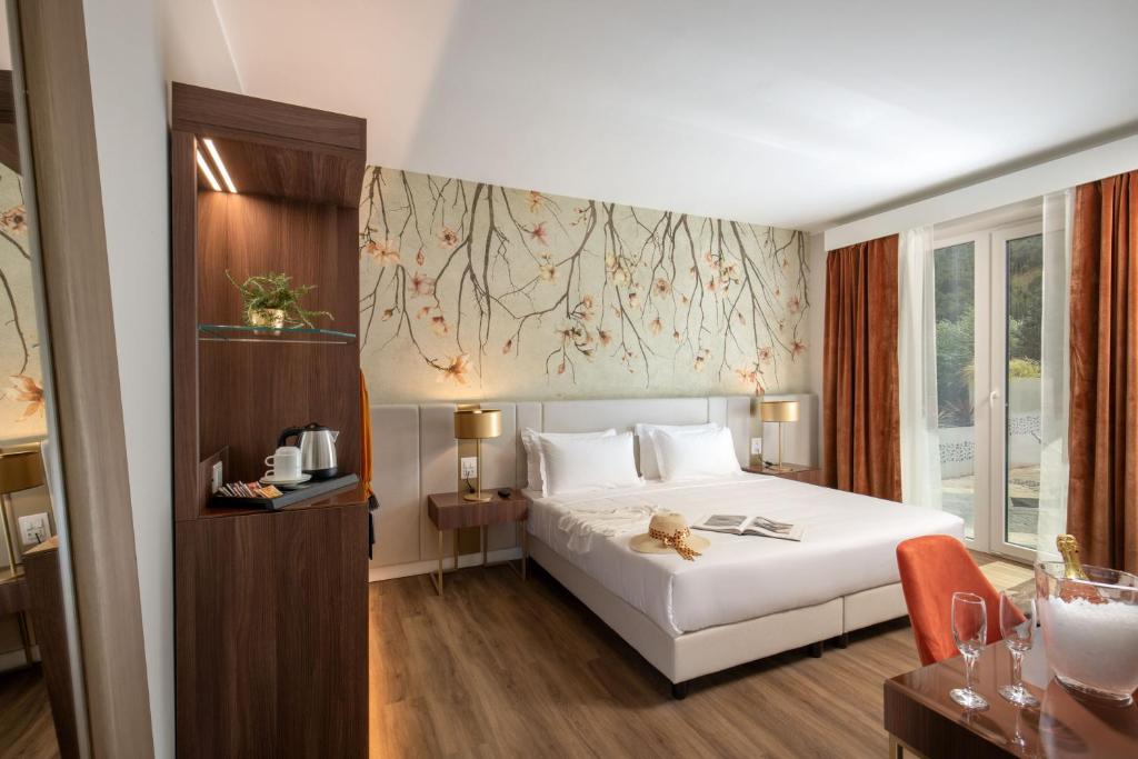 Postel nebo postele na pokoji v ubytování Hotel Della Piana