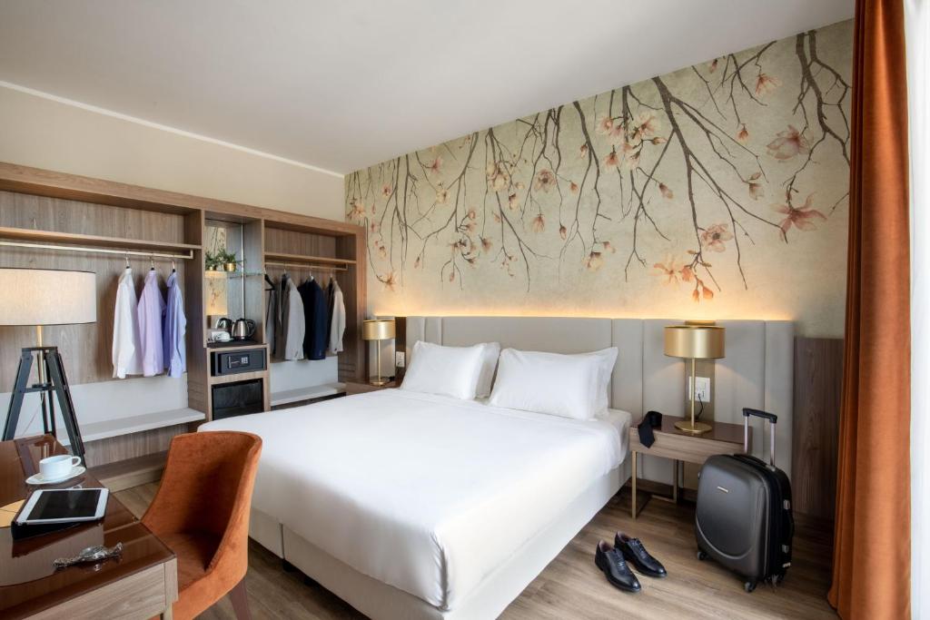 Postel nebo postele na pokoji v ubytování Hotel Della Piana